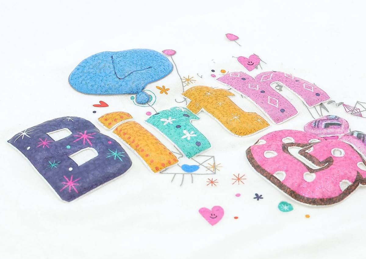 Multicolor puff transfer letters spelling BIRTHDAY in pink, blue, orange, teal and purple